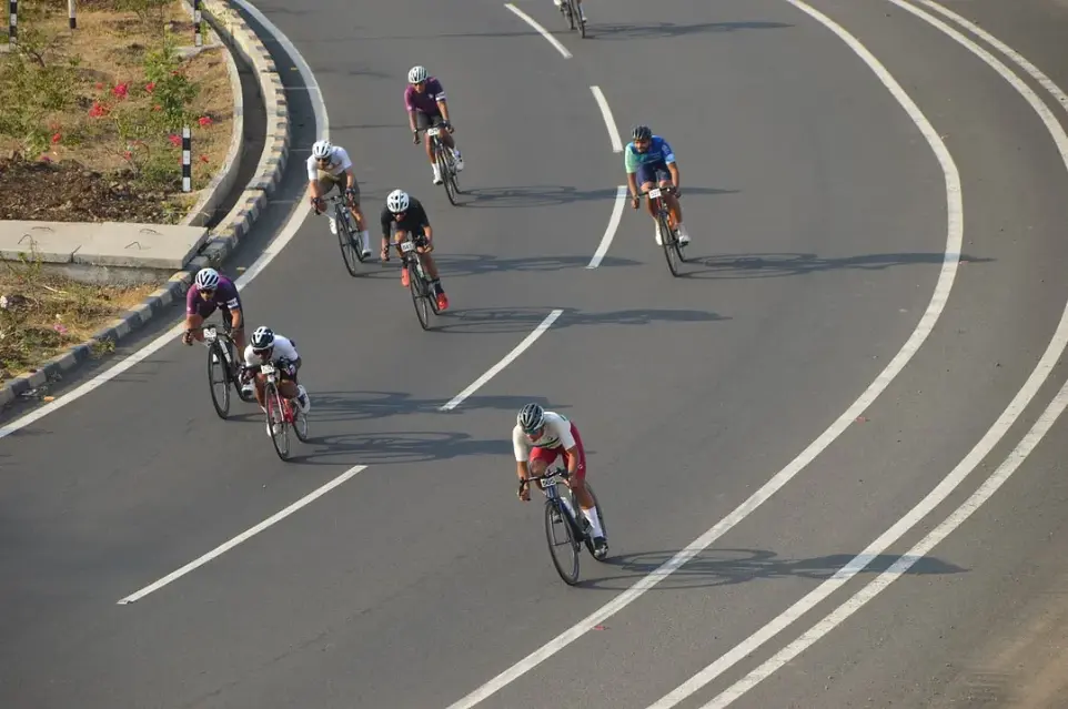 Cyclists racing, descending downhill