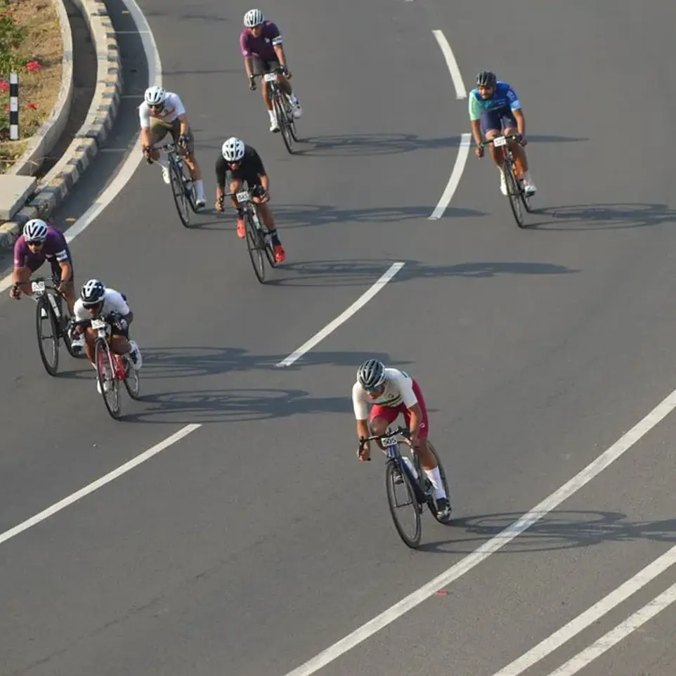 Cyclists racing, descending downhill